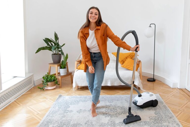 Full-shot-woman-holding-vacuum-cleaner